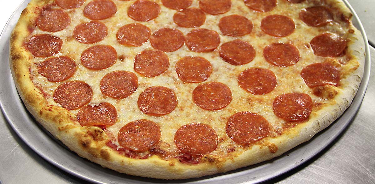 a round pizza with pepperoni
