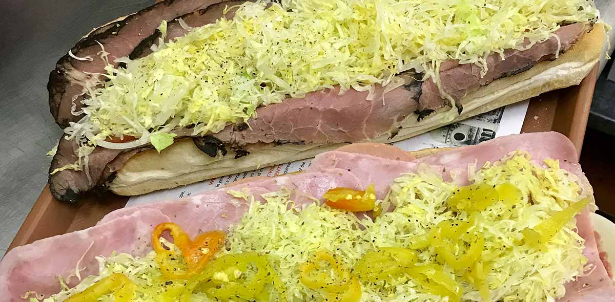 photo of a roast beef sandwich with lettuce and pepper